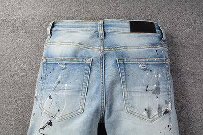 IAC | Black slightly painted skinny light blue jeans