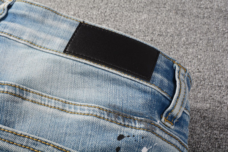 IAC | Black slightly painted skinny light blue jeans